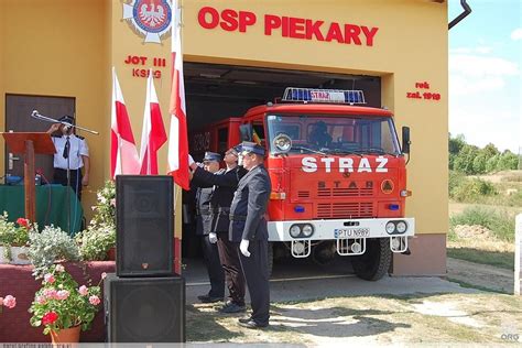 Photo from OSP Piekary celebration, showing decorated firefighters or flag raising