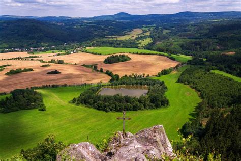 Thematic photo of varied natural landscape, including forests, rivers, and meadows, typical for a protected landscape area in Poland