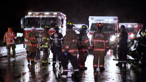 Thematic photo of firefighters working in smoke at night