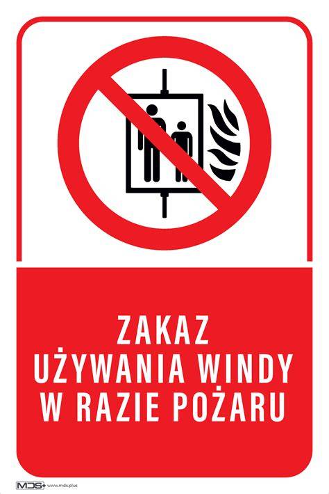 zdjęcie znaku zakazu używania windy w przypadku pożaru umieszczonego obok drzwi windy