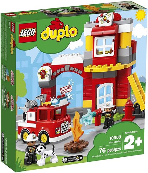 Thematic photo of a child playing with a LEGO Duplo fire station set