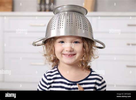 Close-up photo of a person wearing a colander on their head, participating in the service.