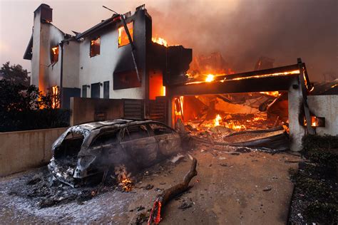 Photo of a destroyed home after a fire, showing personal belongings damage.