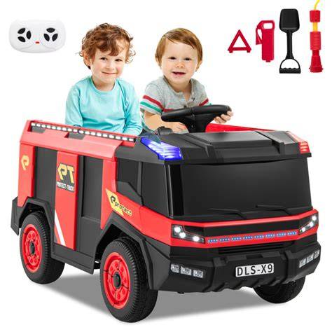 Thematic photo of a child happily playing with a fire truck ride-on toy, showcasing its realistic design