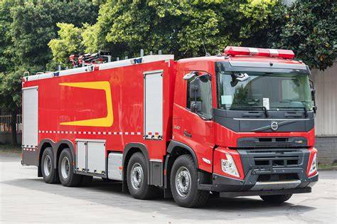 Side view of a medium Volvo fire truck with equipment