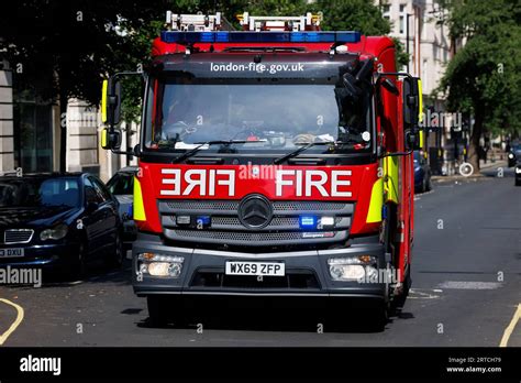 Thematic photo of fire brigade operation with a ladder truck at a residential building