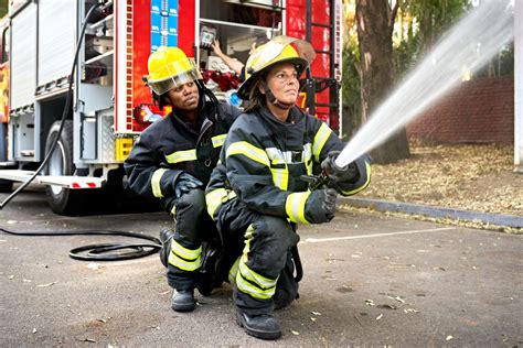 Thematic photo of firefighters in action with hoses