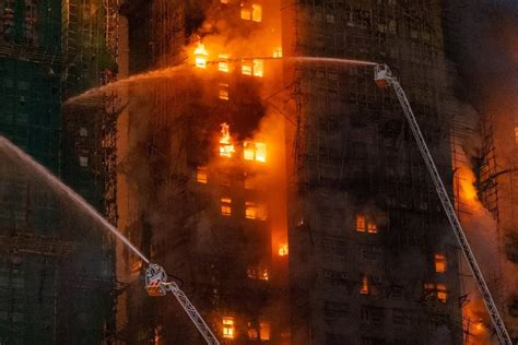 Thematic photo of a multi-story residential building on fire in the night