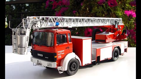Thematic photo of an Iveco Magirus fire truck with an extended ladder