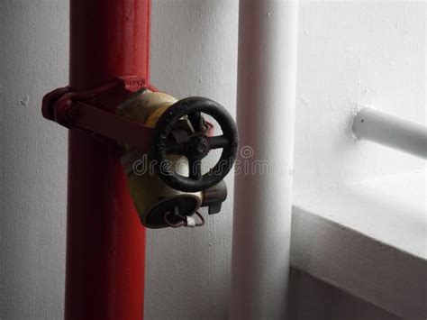 Thematic photo of a fire hydrant in a modern building corridor