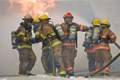 Photo of firefighters working at the scene of a large fire