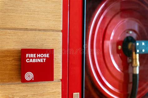 Thematic photo of a fire hose cabinet in a building corridor