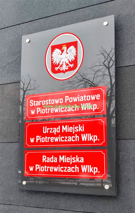 Przykładowa tablica urzędowa z godłem państwowym
