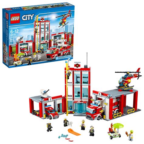 The LEGO City Fire Station 60110 set assembled, showing the main building, vehicles, and minifigures