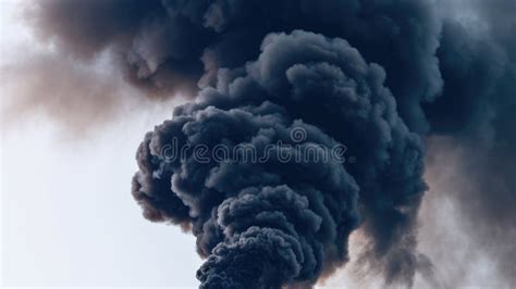 Thematic photo of thick black smoke billowing over an urban area.
