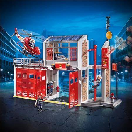 Thematic photo of Playmobil firefighters with a fire station in the background