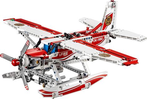 The LEGO Technic 42040 Fire Plane model in its primary configuration, flying over water.