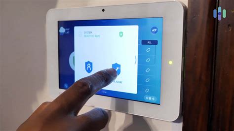 Thematic photo of a modern smart home alarm system control panel or a smartphone displaying a push notification from a security app.