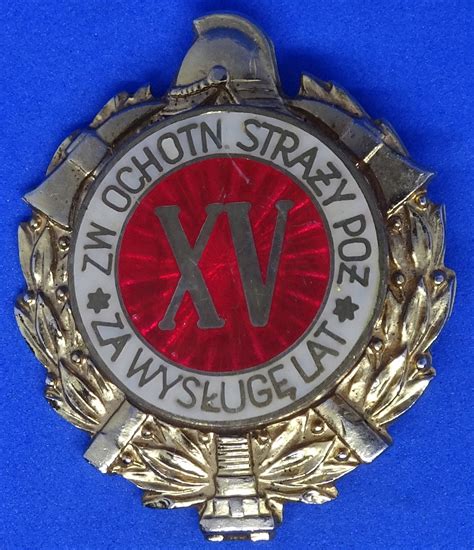 Zdjęcie Odznaki „Za Wysługę Lat” z różnymi oznaczeniami lat.