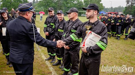 Photo of a youth fire brigade during a competition (sportowo-pożarnicze zawody)