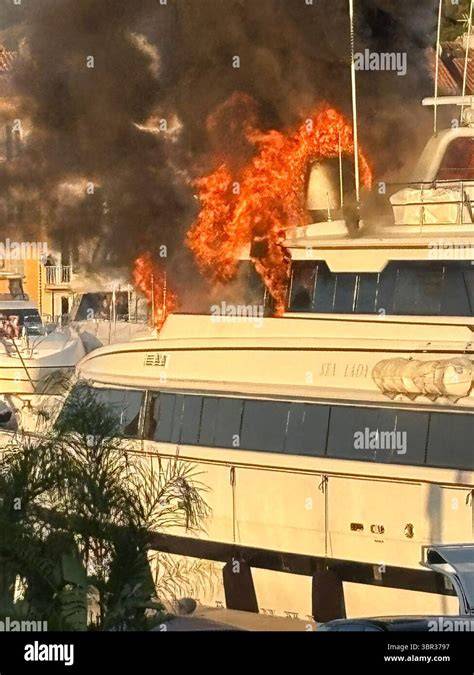 Thematic photo of a yacht engulfed in flames at sea or in port