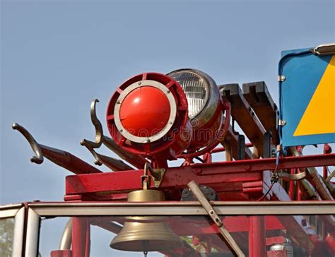 Thematic photo of an OSP siren on a fire station roof, with a fire truck in the foreground