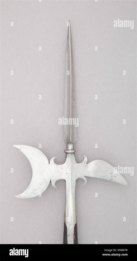 Photo of an OSP halberd with a detailed view of its metal head and wooden shaft