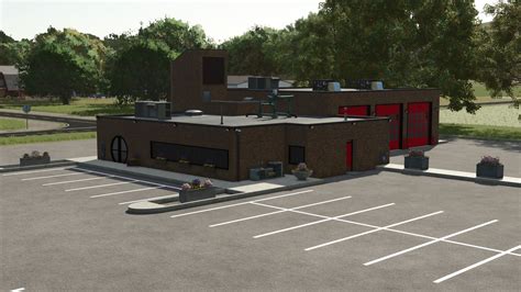 Thematic photo of the newly expanded fire station (remiza) building in Wielkie Drogi, showing the new garage bays.