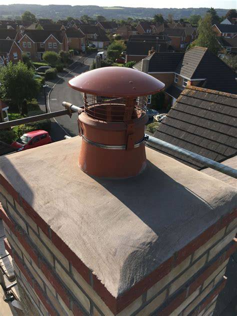 Thematic photo of a chimney cowl protecting a chimney from rain and birds.
