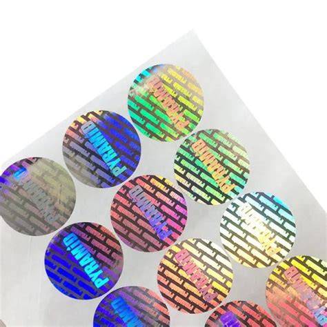 Thematic photo of various custom foil stickers with different logos and designs, some applied to products.
