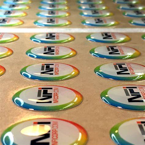 Close-up photo of a 3D dome sticker, showing its raised, glossy finish.