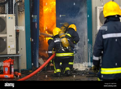 Photo of firefighters entering a building