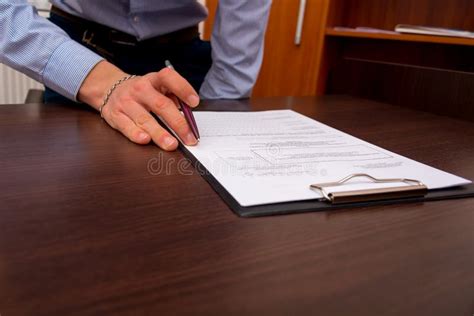 Thematic photo of a firefighter filling out documents at a desk