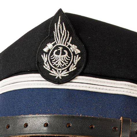 Thematic photo of an OSP member wearing a rogatywka with an OSP cross