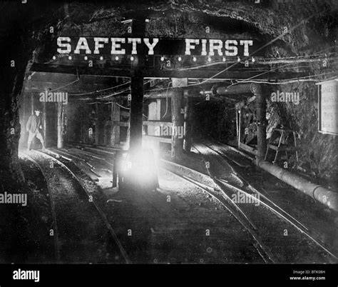 Thematic photo of a coal mine interior with safety signs