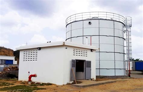 Thematic photo of a large industrial building with a fire fighting water tank in the foreground