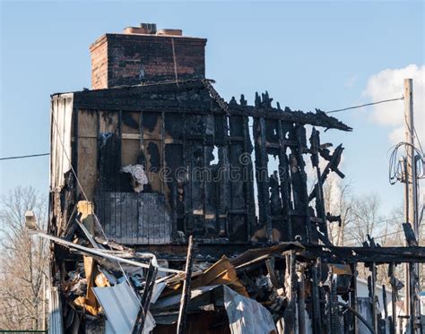 Photo of a completely burned-out residential building after a fire