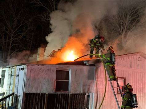 Thematic photo of a fire engine arriving at a residential fire scene