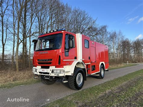 Thematic photo of OSP Biedaczów-Gwizdów firefighters with their IVECO fire truck during an event or training