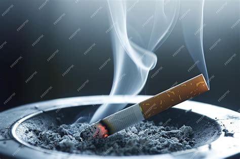 Thematic photo of a smoldering cigarette on upholstery