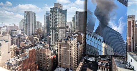 Zdjęcie gęstego dymu unoszącego się nad wieżowcem na Manhattanie