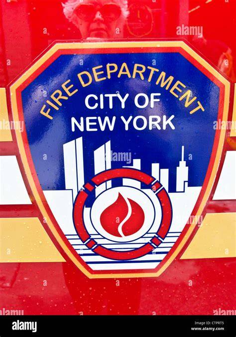 The New York City Fire Department emblem and a fire truck