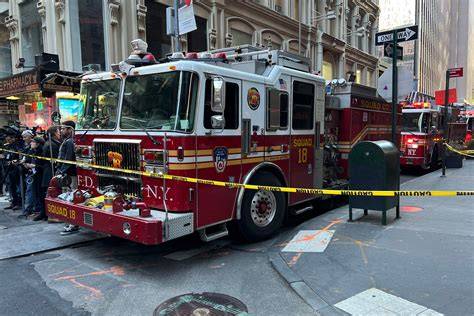 Firefighters battling a blaze at a New York City fire station