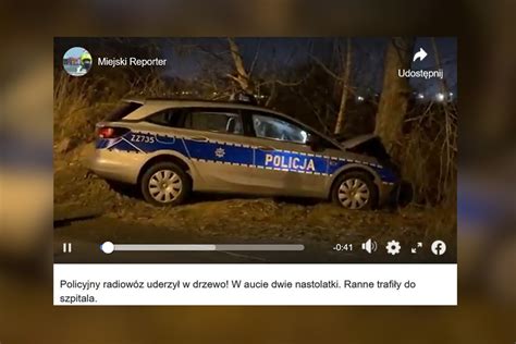 Radiowóz policyjny na miejscu wypadku, z policyjną taśmą zabezpieczającą