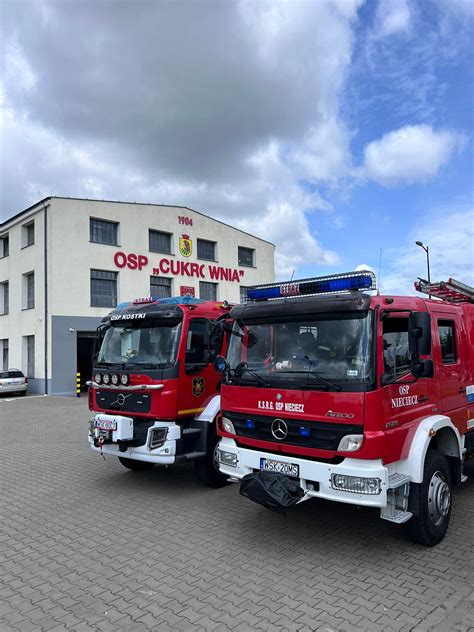 Photo of the newly renovated OSP building in Sokołów Podlaski with fire trucks parked inside