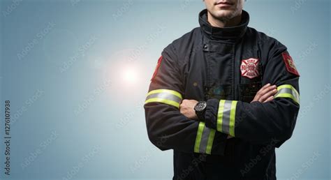 Thematic photo of a firefighter in uniform with visible emblems