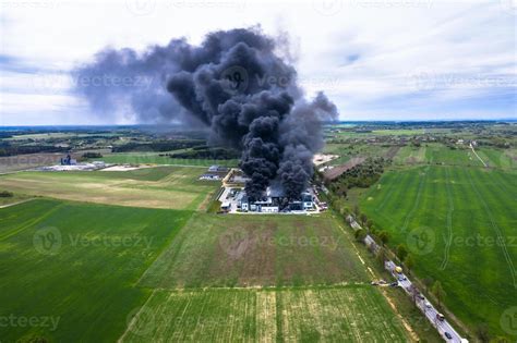 Thematic photo of a large building fire with dense smoke visible from a distance.