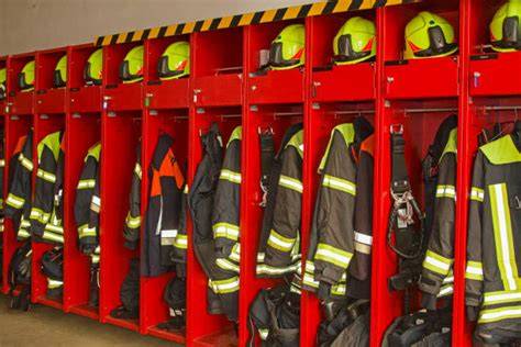 Thematic photo of a firefighter locker in a fire station, showing equipment inside