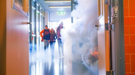 Thematic photo of a fire drill at school, students evacuating