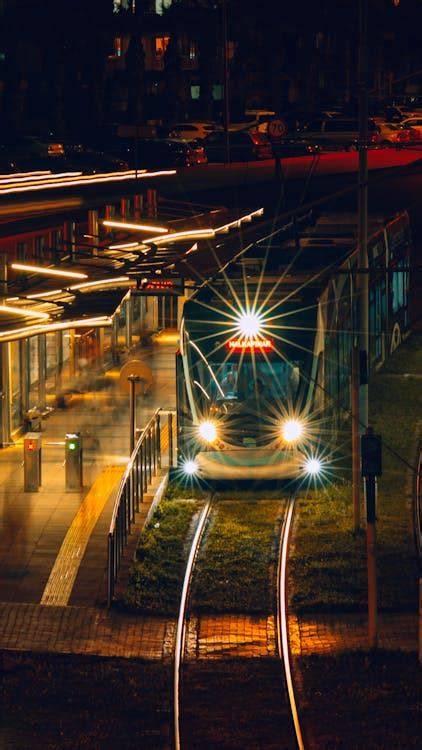 Thematic photo of a tram stop at night in an urban setting